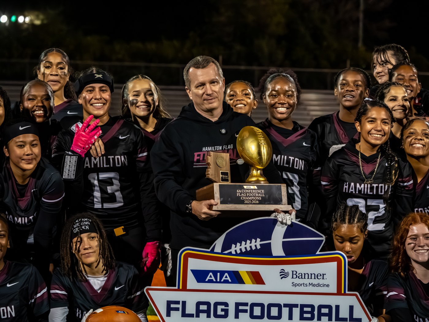 Hamilton High School (AZ) girls' flag football team with their state championship trophy